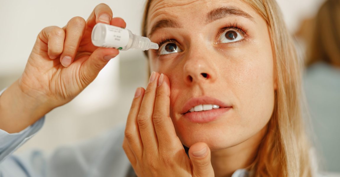 a lady applying eye drops for eye relief and take care of her eyes health