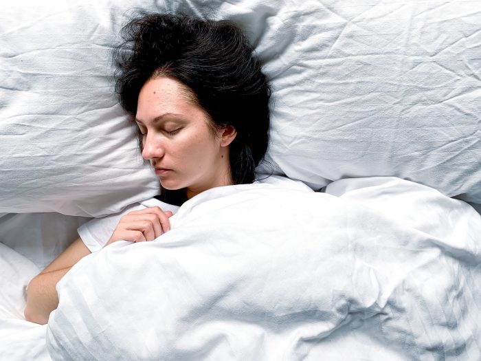 a woman sleeping deeply and resting her eyes